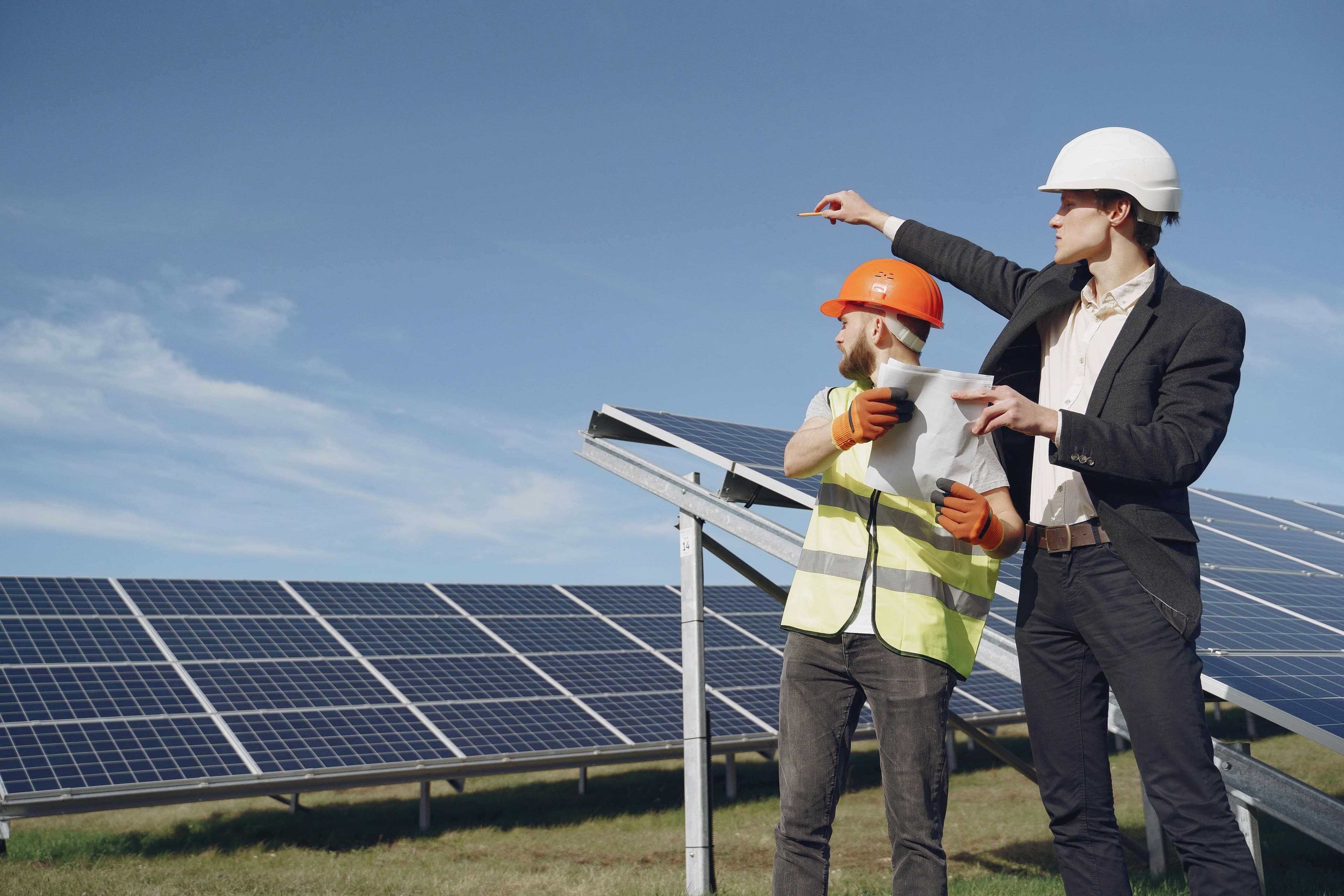 Our engineer and field technician reviewing plans at a solar installation